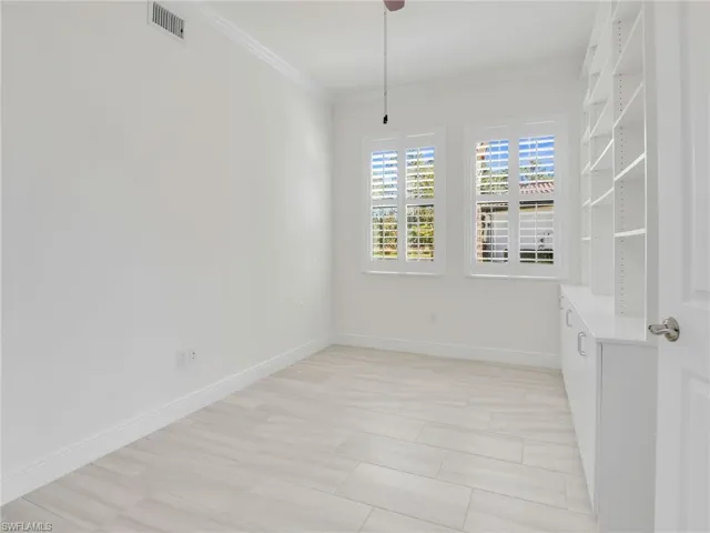 Den With Plantation Shutters & Built Ins