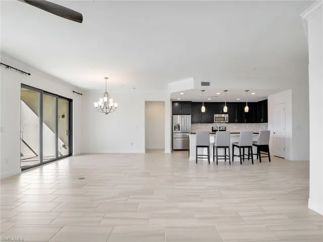 Great Room With Door To Primary Bedroom