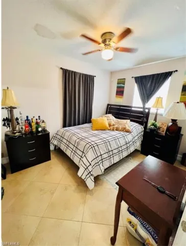Bedroom featuring ceiling fan and light tile patterned floors