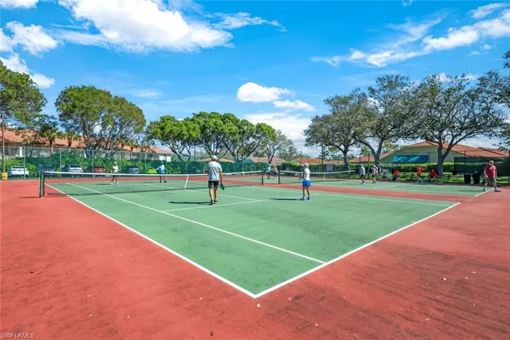 View of tennis court with fence