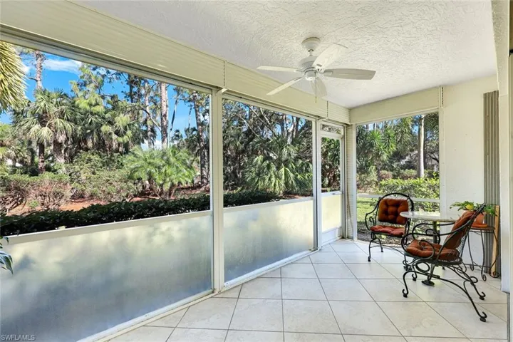 Screened Patio featuring ceiling fan