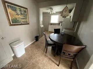 Tiled dining area with ceiling fan