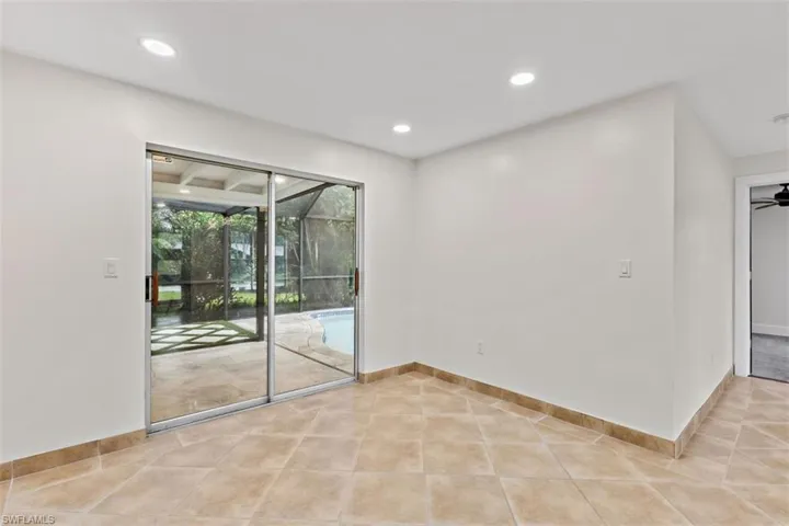 Tiled spare room with ceiling fan