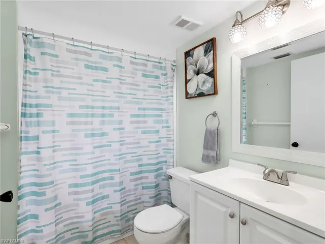 Bathroom with vanity and a shower with curtain