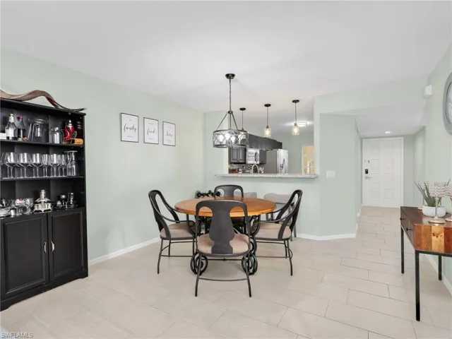 Dining area with baseboards and recessed lighting
