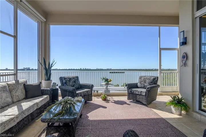 Sunroom with a water view