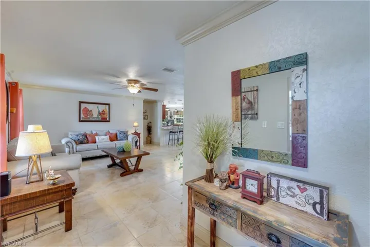 155 Evans Rd, LaBelle, FL 33935 Home entry path to the Living room featuring ceiling fan and ornamental molding
