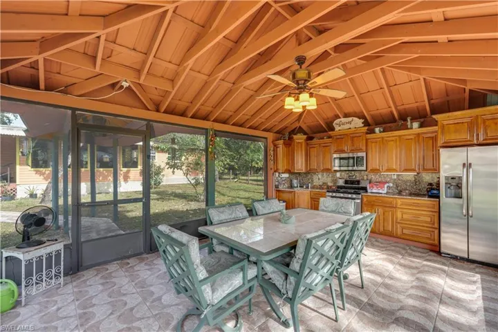 155 Evans Rd, LaBelle, FL 33935 Outdoor kitchen/party room featuring ceiling fan and vaulted ceiling