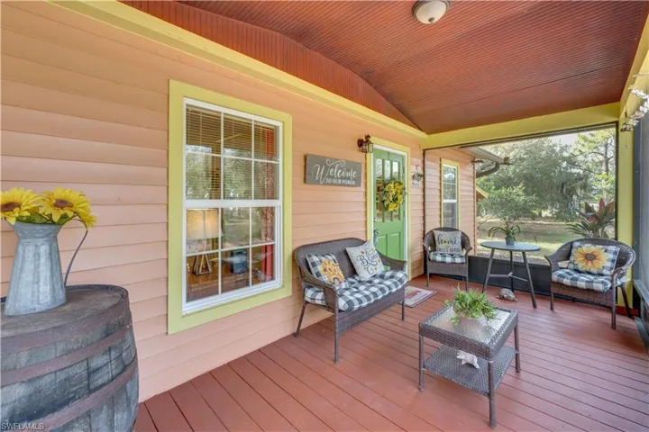 155 Evans Rd, LaBelle, FL 33935 Raised screened front porch featuring wood ceiling and lofted ceiling