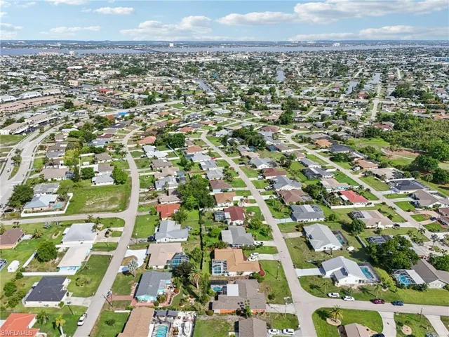 View of property location with nearby suburban area