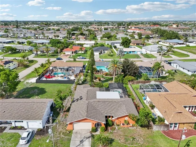 Aerial view of residential area with a pool