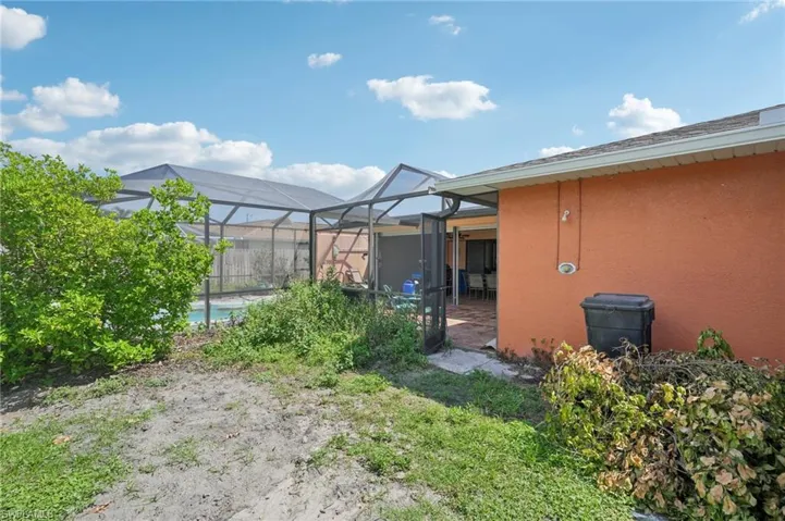 View of yard with a lanai and a patio area