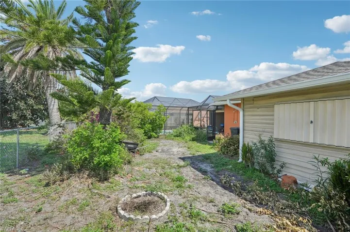 View of yard with a lanai