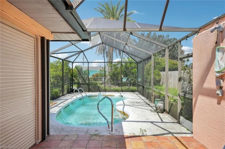 Swimming pool featuring a patio area and a lanai