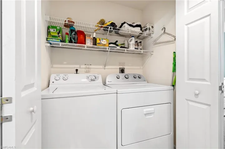Laundry area featuring separate washer and dryer
