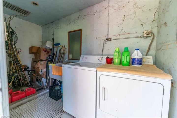 Laundry area featuring separate washer and dryer