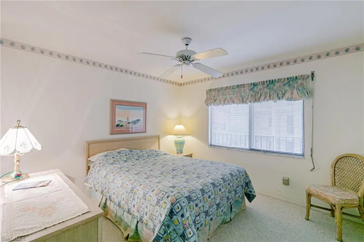 Bedroom with carpet flooring and ceiling fan