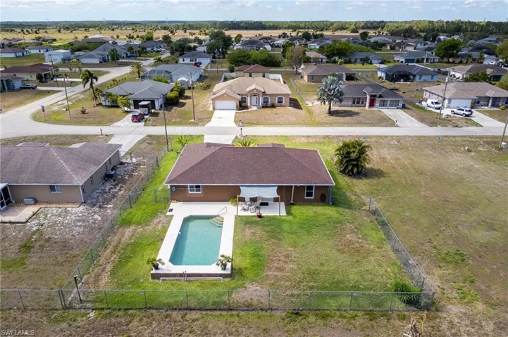 Aerial view of residential area with a pool area