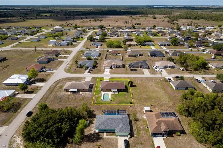 Aerial view of property's location featuring nearby suburban area and property boundaries highlighted