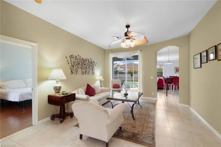 View from Dining Area to Living Room, Sliders to Pool and Breakfast Nook to Family Room and Kitchen