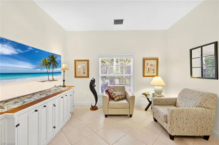 Sitting room with light tile patterned flooring