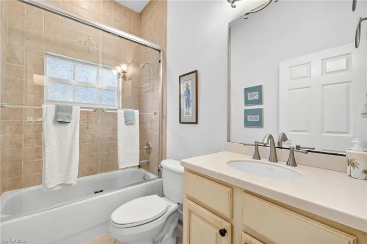 Bathroom featuring shower / washtub combination and vanity