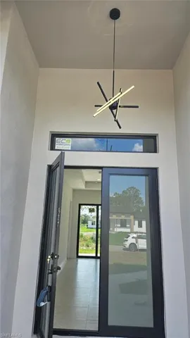 View of exterior entry featuring stucco siding