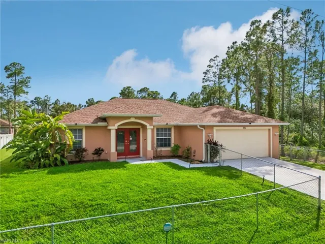 Ranch-style home featuring french doors, stucco siding, driveway, a garage, and a shingled roof