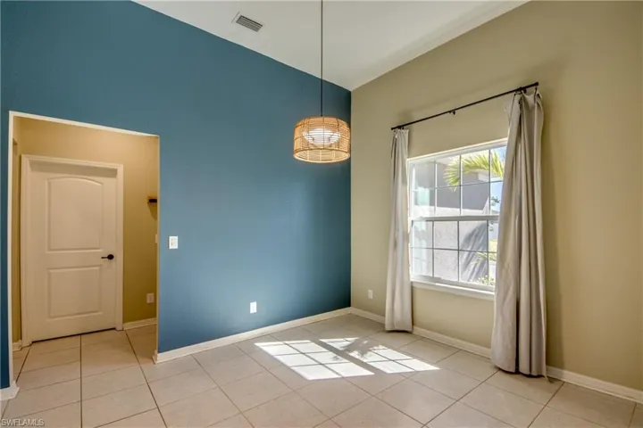 Dining room with baseboards and light tile patterned flooring