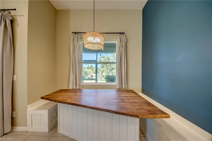Unfurnished dining area featuring light tile patterned floors
