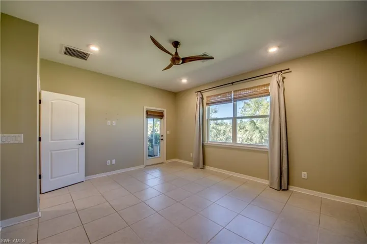 Primary Bedroom featuring a ceiling fan, recessed lighting, and light tile patterned floors