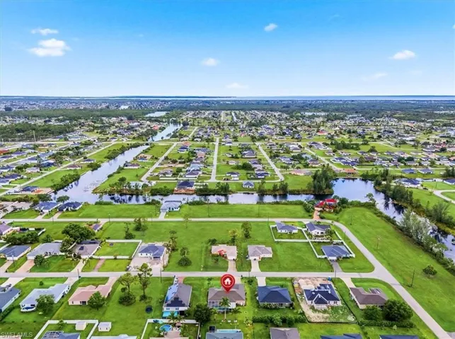 Aerial view showcasing a residential area characterized by numerous canals and waterways