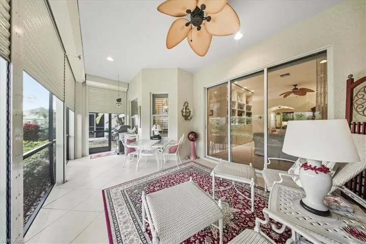 Sunroom with a ceiling fan and healthy amount of natural light