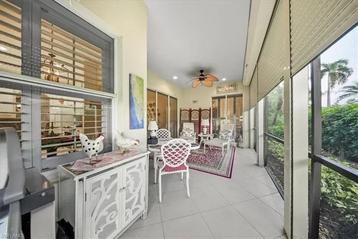 Sunroom featuring a ceiling fan