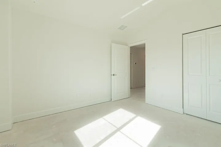 Unfurnished bedroom with a closet