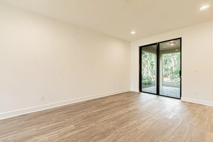 Unfurnished room with light hardwood / wood-style flooring