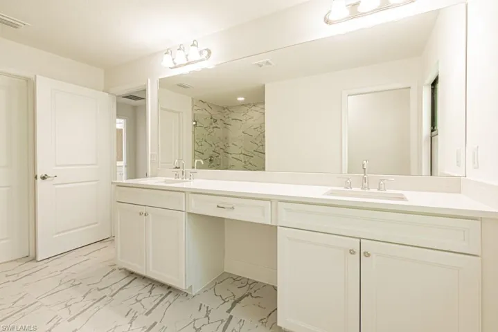 Bathroom featuring vanity and walk in shower