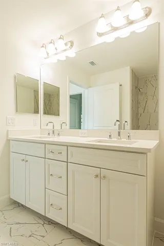 Bathroom with vanity and walk in shower