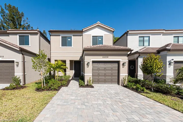 View of front of property with a garage