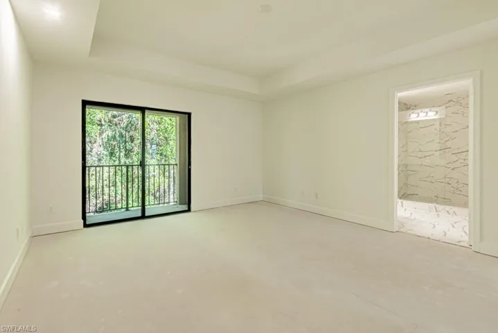 Unfurnished room featuring a raised ceiling