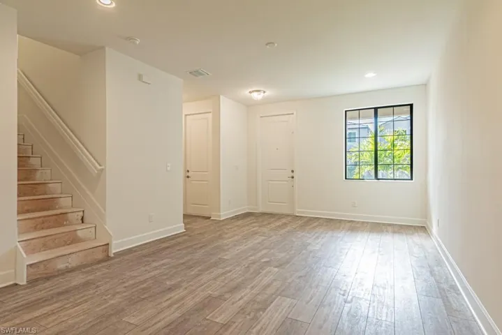 Unfurnished room featuring hardwood / wood-style flooring