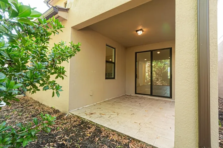 Entrance to property featuring a patio