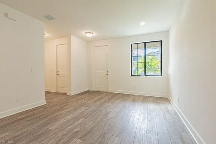 Spare room with wood-type flooring