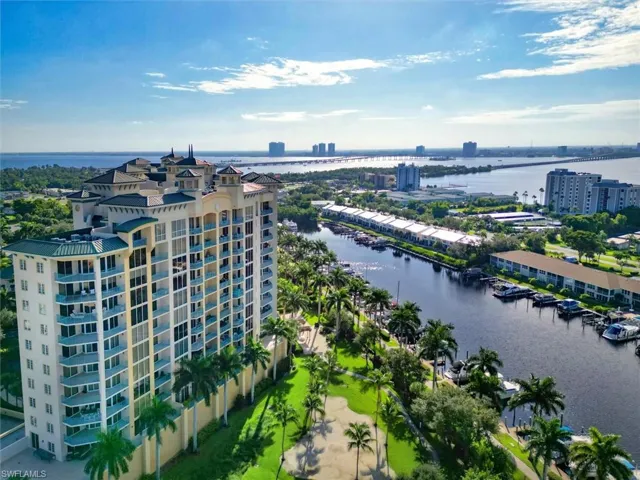 Bird's eye view of apartment complex and a nearby body of water