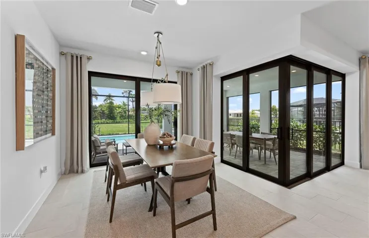 Dining room with baseboards and recessed lighting
