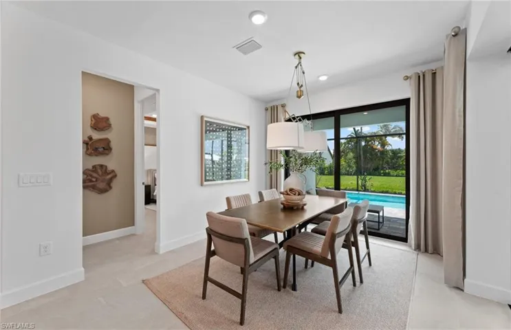 Dining room with baseboards and recessed lighting