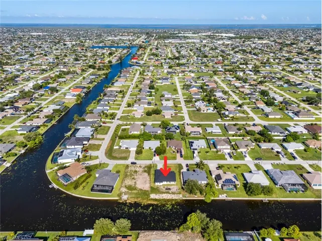 Aerial view of residential area with a nearby body of water