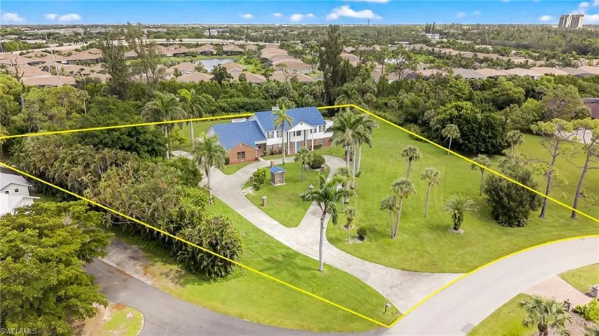 Aerial view of residential area with property boundaries highlighted