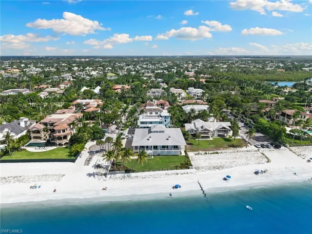 Aerial perspective of suburban area featuring unending shoreline
