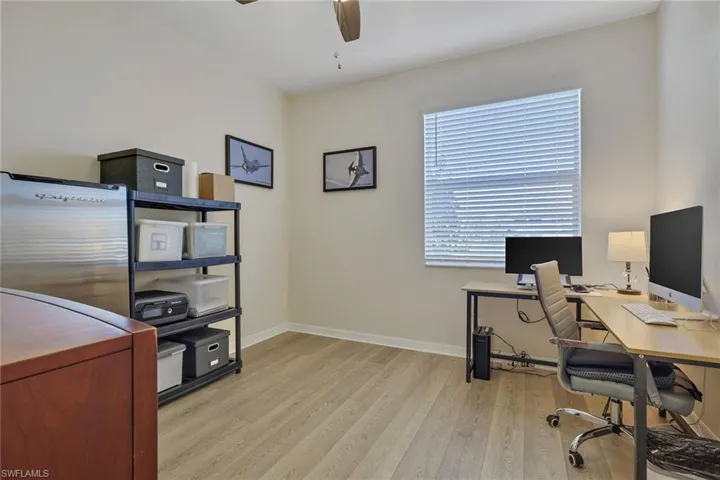 Office with ceiling fan and light wood finished floors